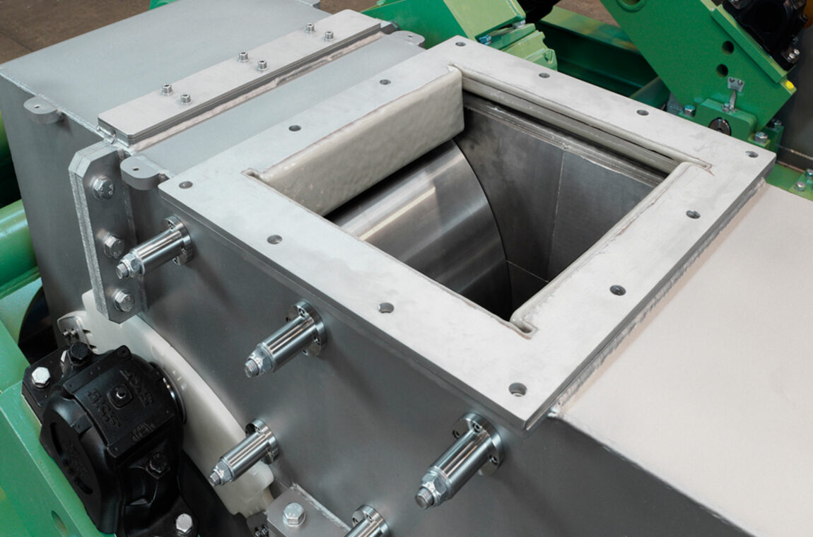 Double roller mill WS 600x400 with tungsten carbide crushing rollers for grinding high-purity silicon - view of material feed