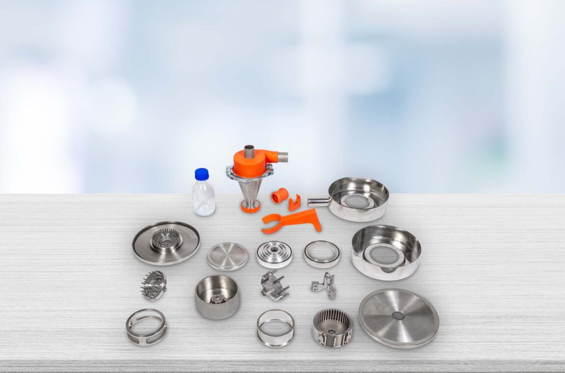 A laboratory universal mill with an attached cyclone separator and a sample collection bottle.
