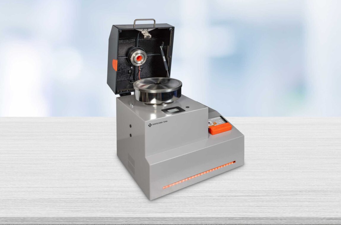 A laboratory universal mill with an attached cyclone separator and a sample collection bottle.